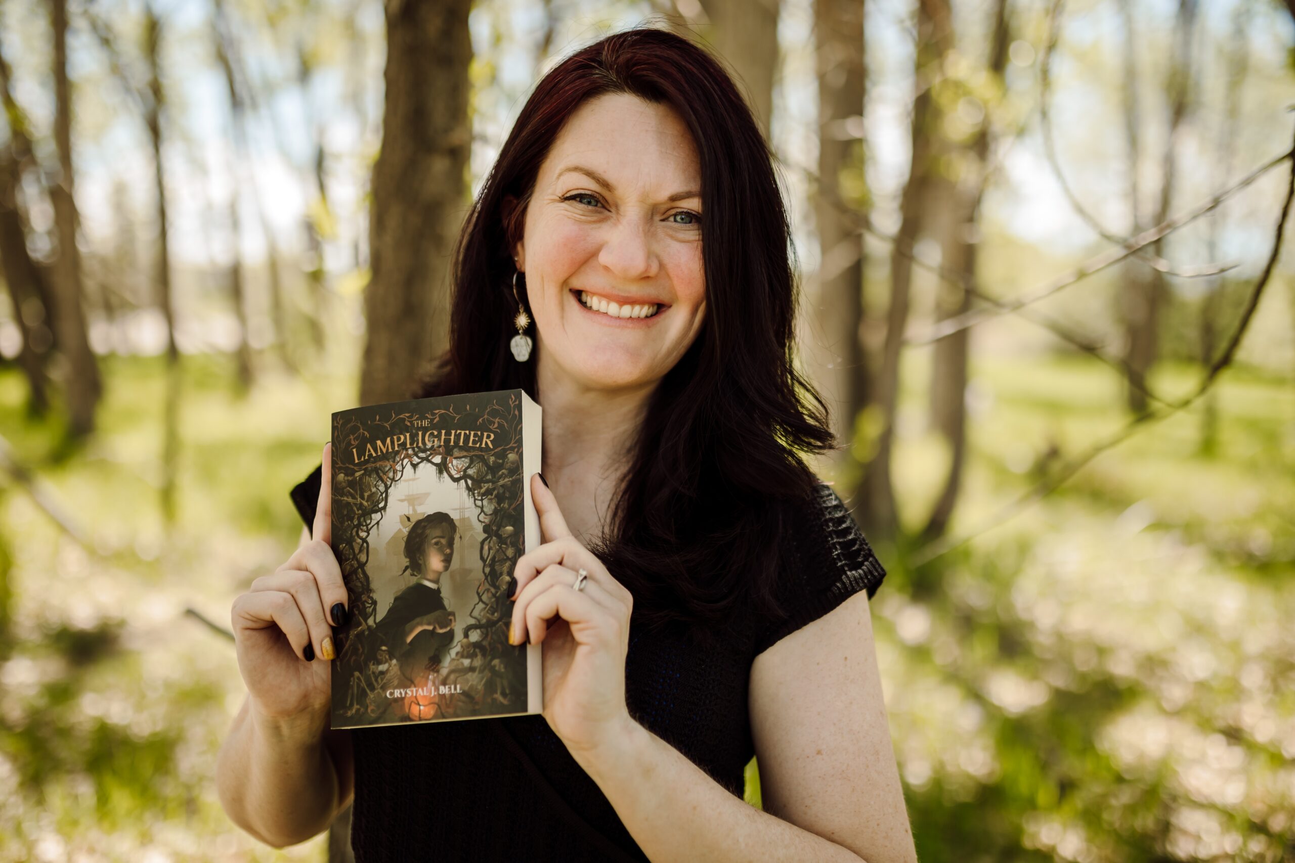 Crystal Bell holding book
