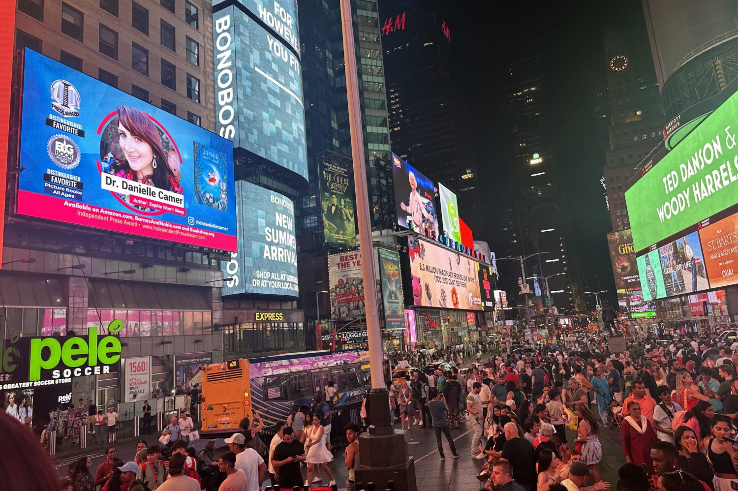 Moonbeam author Dr Danielle Camer’s billboard in Times Square in New York City